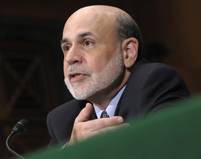 FILE - July 14, 2011 file photo, Federal Reserve Chairman Ben Bernanke testifies on Capitol Hill in Washington, before the Senate Banking Committee hearing to deliver the semiannual Monetary Policy Report. Bernanke told Congress in July that the Fed was ready to act if the economy weakened. (AP Photo/Susan Walsh, File).