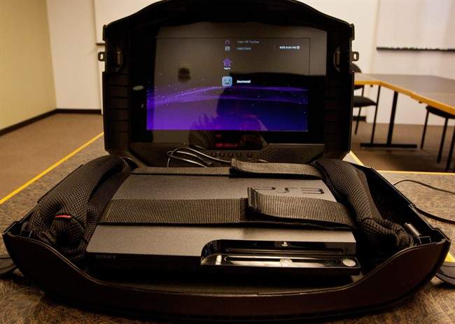 The GAEMS G155, a rugged game console case with a built-in high-definition display, is displayed Monday, Aug. 29, 2011 in Atlanta, Ga. The GAEMS case allows the user to take an Xbox 360 or Sony PlayStation system and accesories on the road. (AP Photo/Ron Harris).