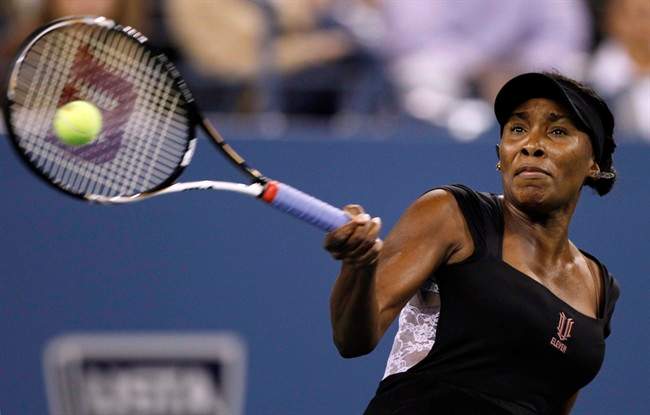 Venus Williams, of the United States, returns against Vesna Dolonts, of Russia, during the first round of the U.S. Open tennis tournament in New York, Monday, Aug. 29, 2011. (AP Photo/Charles Krupa).