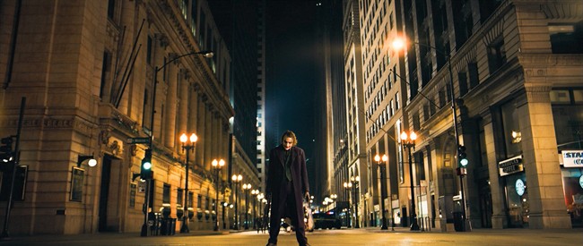 FILE - In this undated image released by Warner Bros., Heath Ledger is shown in a scene from, "The Dark Knight." in the decade since Sept. 11, movies have turned dark, paranoid and questioning. Even in the most popular films of the decade, a post-9/11 atmosphere is unmistakable. (AP Photo/Warner Bros.).