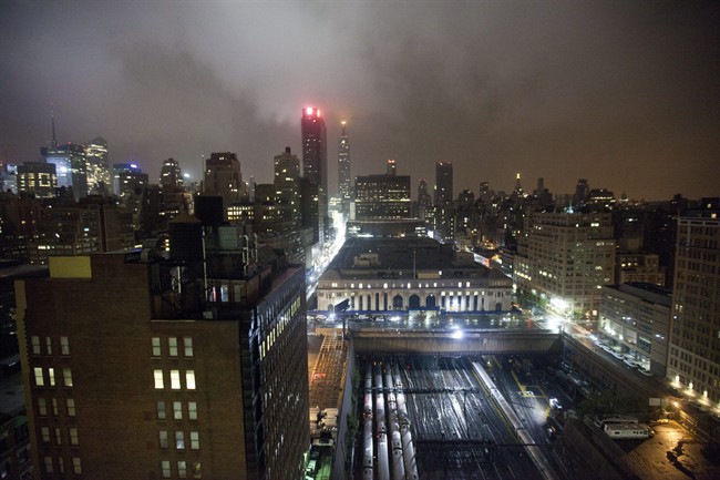 The New York City skyline is seen under clouds as Hurricane Irene approaches the region, early Sunday, Aug. 28, 2011, in New York. Irene has the potential to cause billions of dollars in damage along a densely populated arc that includes Washington, Baltimore, Philadelphia, New York, Boston and beyond. At least 65 million people could be affected. (AP Photo/Karly Domb Sadof).