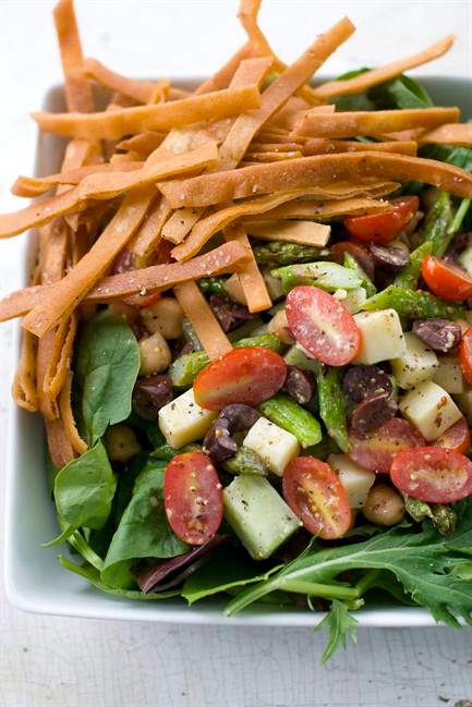 This July 25, 2011 photo shows asparagus chopped salad with Meyer lemon dressing in Concord, N.H. For the AP’s 20 Salads of Summer series, celebrity chef Bobby Flay offered this salad from his upcoming cookbook, "Bobby Flay's Bar Americain Cookbook." (AP Photo/Matthew Mead).