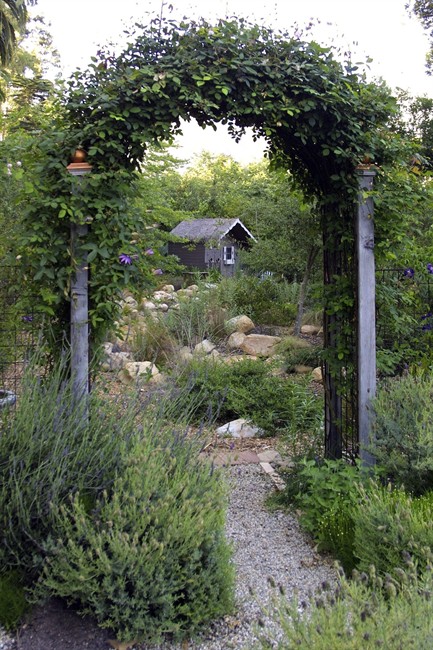 This undated photo courtesy of Holly Lepere Photography shows an outdoor space designed by Grace Designs. There are many creative fencing and landscape options that can help create a zone of privacy in your yard. (AP Photo/Holly Lepere Photography).