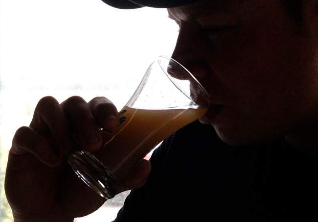 In this July 25, 2011 photo, Flying Dog Brewery's head brewer Ben Clark takes a sip of wort, a sugary liquid that is fermented by yeast to eventually create beer, at the brewery's headquarters in Frederick, Md. The company plans to end shipments to more than a dozen states beyond the east coast in order to burnish its image as a craft brewer and attract more consumers who are interested in buying local. (AP Photo/Patrick Semansky).