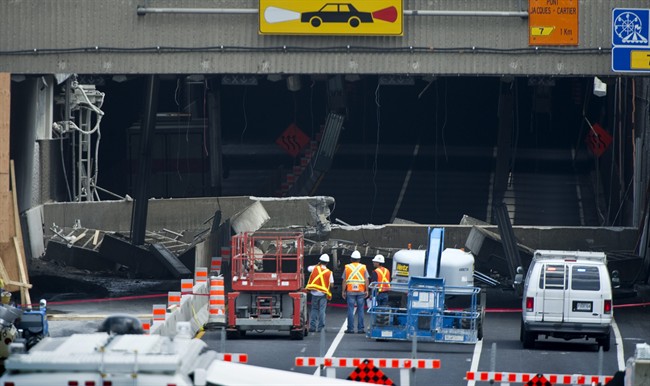 Engineers inspect a concrete slab that fell Sunday on a major expressway Monday, August 1, 2011 in Montreal. No one was injured in the collapse, the latest in a series of incidents that point to the city's crumbling infrastructure. THE CANADIAN PRESS/Paul Chiasson.