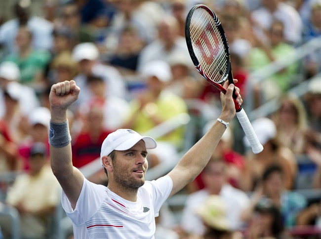 Mardy Fish, from the United States, celebrates his victory over Janko Tipsarevic, from Serbia, during semi-final play at the Rogers Cup tennis tournament Saturday, August 13, 2011, in Montreal. Fish won 6-3, 6-4 to move on to the final. THE CANADIAN PRESS/Paul Chiasson.