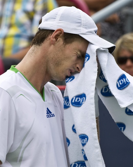 Andy Murray from Great Britain wipes his face during his match against Kevin Anderson of South Africa at the Rogers Cup tennis tournament Tuesday, August 9, 2011 in Montreal. Anderson won 6-3, 6-1. THE CANADIAN PRESS/Paul Chiasson.