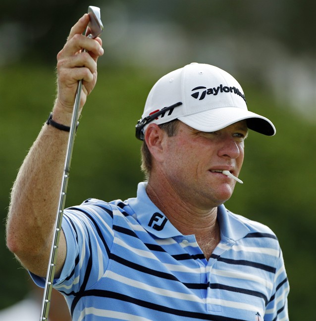 Scott Verplank gets ready to hit a shot on the seventh hole during the second round of the PGA Championship golf tournament Friday, Aug. 12, 2011, at the Atlanta Athletic Club in Johns Creek, Ga. (AP Photo/Charlie Krupa).