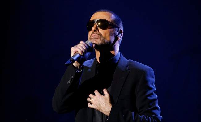 Brittish singer George Michael performs during his first Symphonica concert at the State Opera House in Prague, Czech Republic, Monday, Aug. 22, 2011. (AP Photo/Petr David Josek).