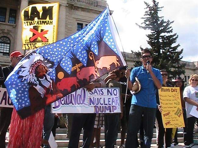 Elder Tim Peekeekoot from the Ahtahkakoop Cree nation talks to a crowd gathered in front of the Saskatchewan legislature Tuesday Aug. 16, 2011. The protestors want the province to ban nuclear waste. The federal Nuclear Waste Management Organization is trying to find a site for an underground storage dump for the entire country and is considering three Saskatchewan communities. THE CANADIAN PRESS/ Jennifer Graham.