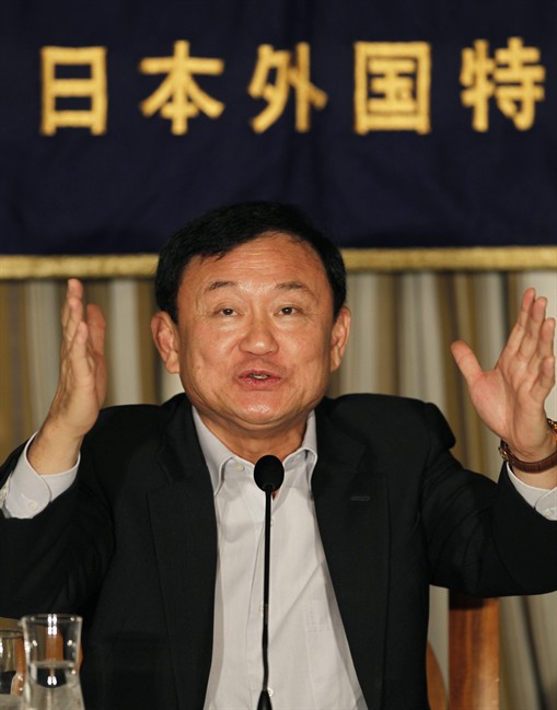 Former Thai Prime Minister Thaksin Shinawatra speaks during a press conference at the Foreign Correspondents' Club of Japan in Tokyo Tuesday, Aug. 23, 2011. Fugitive Thaksin defended his controversial visit to disaster-stricken Japan, saying he wants to support the country that helped his own people recover from a massive tsunami in 2004. (AP Photo/Hiro Komae).