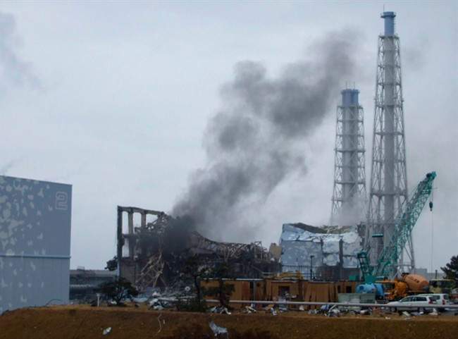 In this March 21, 2011 photo, gray smoke rises from Unit 3 of the tsunami-stricken Fukushima Dai-ichi nuclear power plant in Okuma, Fukushima prefecture, Japan.