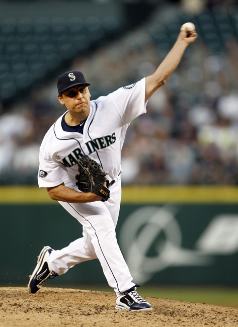 Seattle Mariners' pitcher Jason Vargas throws against the Toronto Blue Jays in the third inning of a baseball game, Tuesday, Aug.16, 2011, in Seattle. (AP Photo/Kevin P. Casey).