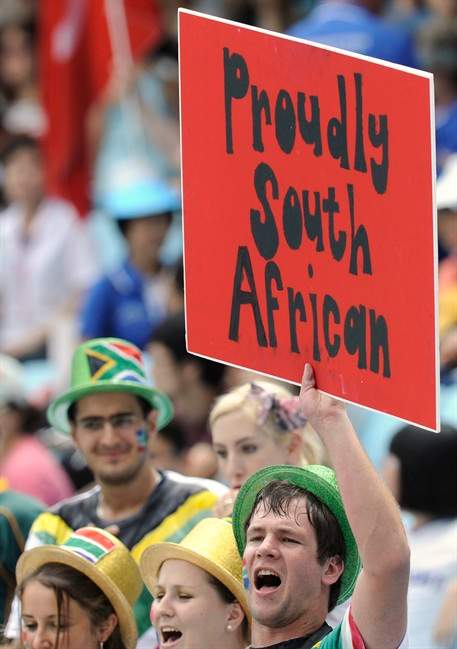 A spectator holds up a placard before South Africa's Oscar Pistorius competes in a heat for the Men's 400m at the World Athletics Championships in Daegu, South Korea, Sunday, Aug. 28, 2011. (AP Photo/Martin Meissner).