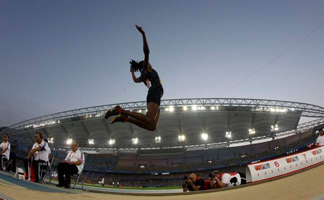 USA's Brittney Reese competes in the final of the Women's Long Jump at the World Athletics Championships in Daegu, South Korea, Sunday, Aug. 28, 2011.(AP Photo/David J. Phillip).