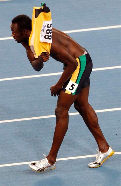 Jamaica's Usain Bolt reacts after being disqualified after a false start in the Men's 100m final at the World Athletics Championships in Daegu, South Korea, Sunday, Aug. 28, 2011. (AP Photo/Kin Cheung).