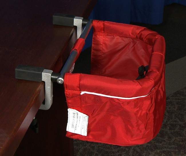 This image provided by the Consumer Product Safety Commission shows a version of the "metoo" clip-on chairs imported by Colorado-based phil&teds USA Inc., that can unexpectedly detach from a table, sending the chair and possibly the child to the floor according to the CPSC. Tens of thousands of the tabletop feeding chairs for babies and toddlers were recalled Wednesday, Aug. 17, 2011, after reports that they can come loose and send children plummeting to the floor. (AP Photo/CPSC).