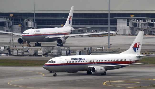 In this picture taken June 4, 2011, Malaysia Airline jetliners taxi at Kuala Lumpur International Airport in Sepang, Malaysia.