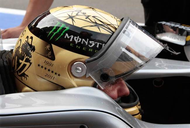 Seven stars on the helmet of Mercedes Grand Prix driver Michael Schumacher of Germany indicate his seven victories on the Belgian circuit, during his 20-year career, during the first practice session ahead of the Belgian Formula One Grand Prix in Spa-Francorchamps, Belgium, Friday, Aug. 26, 2011. (AP Photo/Yves Logghe).