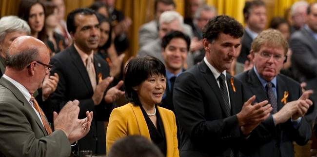 Olivia Chow, NDP MP and wife of former leader Jack Layton, is applauded after delivering a tribute to her husband in the House of Commons on Parliament Hill in Ottawa, Monday September 19, 2011. THE CANADIAN PRESS/Adrian Wyld.