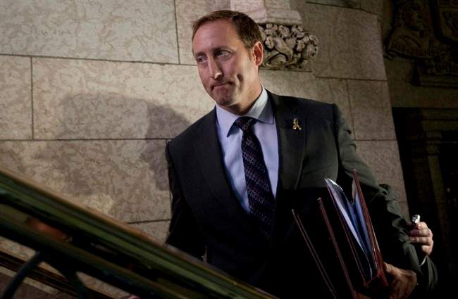 Minister of National Defence Peter MacKay leaves the House of Commons after speaking with the media on Parliament Hill in Ottawa, Thursday September 29, 2011. THE CANADIAN PRESS/Adrian Wyld.