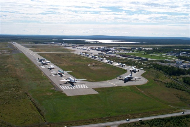 In this Sept. 12, 2001 photo provided by the Canadian government agency Nav Canada, planes line up on the runway of the Gander, Newfoundland, Canada airport after they were diverted to the remote town following the terrorist attacks on the United States on Sept 11, 2001. Thirty eight planes carried in 6,600 passengers. Residents took care of the stranded passengers for days and many of them have remained in touch with them since. (AP Photo/Nav Canada).