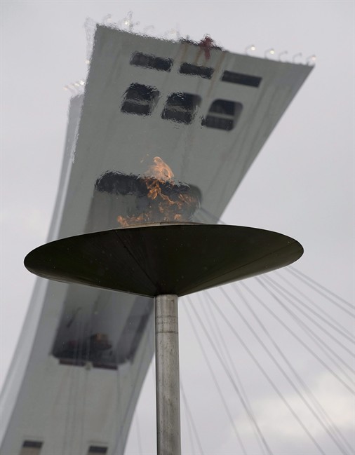 The urn in front of Montreal's Olympic Stadium in which the Olympic flame burned during the 1976 Olympics in Montreal is relit on August 8, 2008 and will remain lit for the duration of the Olympics in Beijing. Quebecers are about to kick off brainstorming sessions on the future of one of Canada's biggest white elephants: Montreal's Olympic Stadium. THE CANADIAN PRESS/Peter McCabe.
