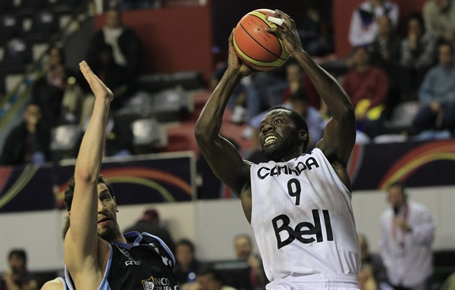 Canada's Denham Brown, right, goes to the basket against Uruguay's Nicolas Borsellino during a FIBA Americas Championship basketball game in Mar del Plata, Argentina, Wednesday, Sept. 7, 2011. The top two finishers of the tournament get an automatic berth in the 2012 London Olympics and the next three advance to the last-chance Olympic qualifier to be held in July 2012. (AP Photo/Martin Mejia).