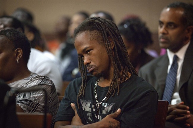 Ha-Rel Butler, fiance of 22-year-old mother of four, Julian Jones, looks on as Former Washington Wizards guard Javaris Crittenton appears during a hearing on murder charges in the drive-by shooting of Jones, Tuesday, Sept. 27, 2011 in Fulton County Superior Court in Atlanta. (AP Photo/David Goldman, Pool).