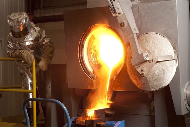 A worker pour gold at the Agnico-Eagle Mines Ltd. (TSX:AEM) Meadowbank, Nunavut gold mine, in this company handout photo. THE CANADIAN PRESS/HO, Agnico-Eagle.