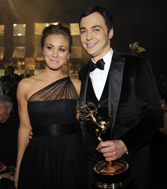"The Big Bang Theory" actor Jim Parsons, right, winner of the Emmy for best actor in a comedy series is joined by castmate Kaley Cucco at the 63rd Primetime Emmy Awards Governors Ball on Sunday, Sept. 18, 2011 in Los Angeles. (AP Photo/Chris Pizzello).