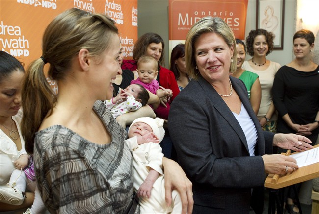 Ontario NDP leader Andrea Horwath stands with new mothers and their babies at a birthing centre in Toronto during her election campaign on Wednesday September 21, 2011. Ontario's NDP is promising to develop a breastfeeding strategy and create four birthing centres staffed by midwives if elected Oct. 6. THE CANADIAN PRESS/Chris Young.