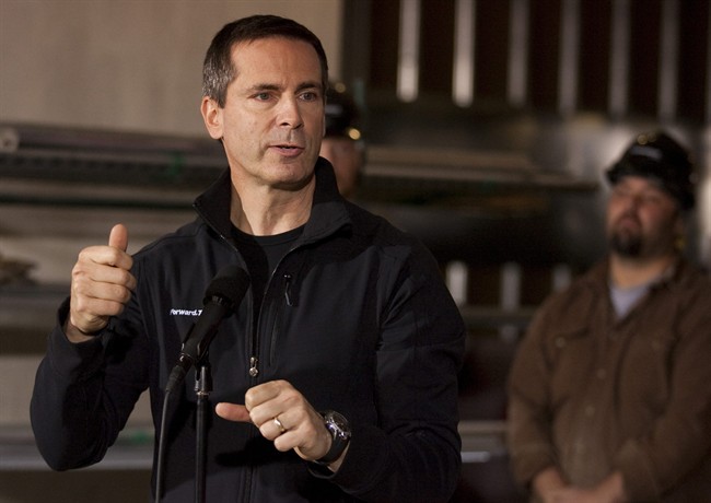 Ontario Premier Dalton McGuinty answers a reporer's question as he visits a new development site for Toronto's Sick Kids Hospital as he continues his campaign for re-election on Sunday September 18, 2011. THE CANADIAN PRESS/Chris Young.