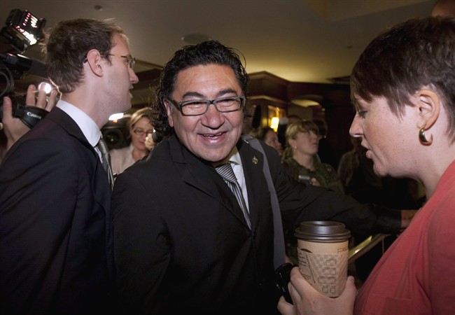 Romeo Saganash, MP for Abitibi-Baie-James-Nunavik-Eeyou, makes his way through the crowd of reporters and staff upon arriving to the NDP caucus meeting Wednesday, September 14, 2011 in Quebec City. The NDP leadership race has another candidate.MP Romeo Saganash says he wants to replace Jack Layton. THE CANADIAN PRESS/Jacques Boissinot.