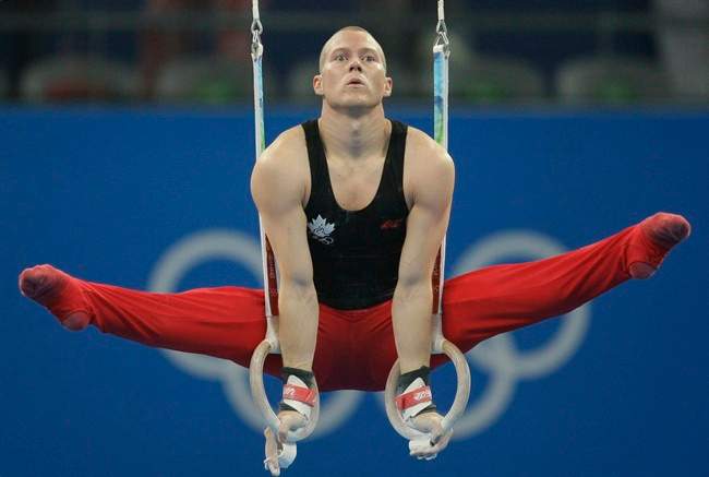 Canadian gymnast Kyle Shewfelt performs at the rings during the men's qualification rounds at the Beijing 2008 Olympics. THE CANADIAN PRESS/AP, Matt Dunham.