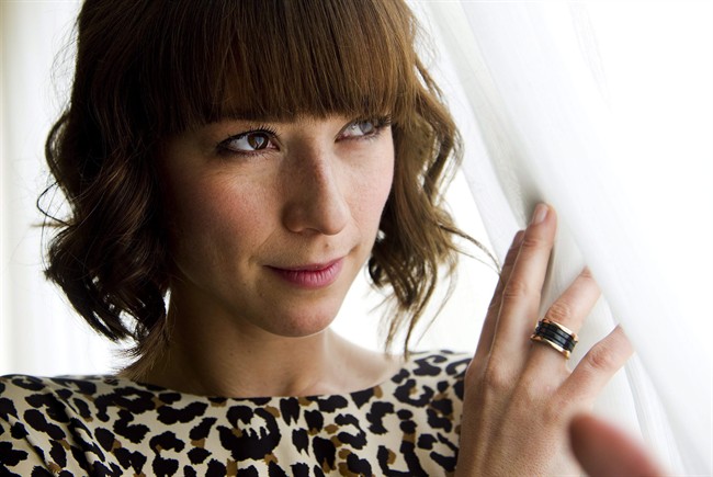 Karine Vanasse poses for a photograph for her new movie "I'm Yours" at the Toronto International Film Festival in Toronto on Sunday, Sept., 11, 2011. After a lengthy career of largely francophone roles, Quebec actress Vanasse is preparing for her career to take off in English with her U.S. network debut as one of four sexy flight attendants in ABC's “Pan Am” this weekend. THE CANADIAN PRESS/Nathan Denette.