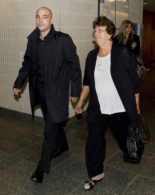 Family members of former boxing champion Arturo Gatti, including brother Fabrizio, left, and mother Ida, take a break from proceedings at the Montreal courthouse in Montreal Tuesday, Sept., 6, 2011 where a civil case has begun to determine the beneficiary of Gatti's estate. Fabrizio Gatti says he's fighting over the late boxer's estate because he wants to make sure his niece and nephew get the money THE CANADIAN PRESS/Graham Hughes.
