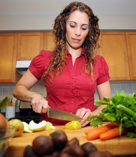 Emily Richards prepares her pear stuffing in her Guelph, Ont., kitchen on Thursday Sept. 22, 2011. Turkey stuffing is one of those foods that commands great loyalty in some families, who make it holiday after holiday, year after year, sometimes generation after generation. THE CANADIAN PRESS/Tony Saxon.