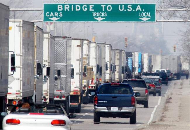 Three-hour delays snarl truck traffic along Huron Church Road in Windsor, Ont., Wednesday, April 2, 2003. The Sept. 11 attacks created a ripple effect of enhanced security, procedural changes and weariness amongst travellers, especially at the Windsor-Detroit crossing — one of the busiest in North America. THE CANADIAN PRESS/Jason Kryk.