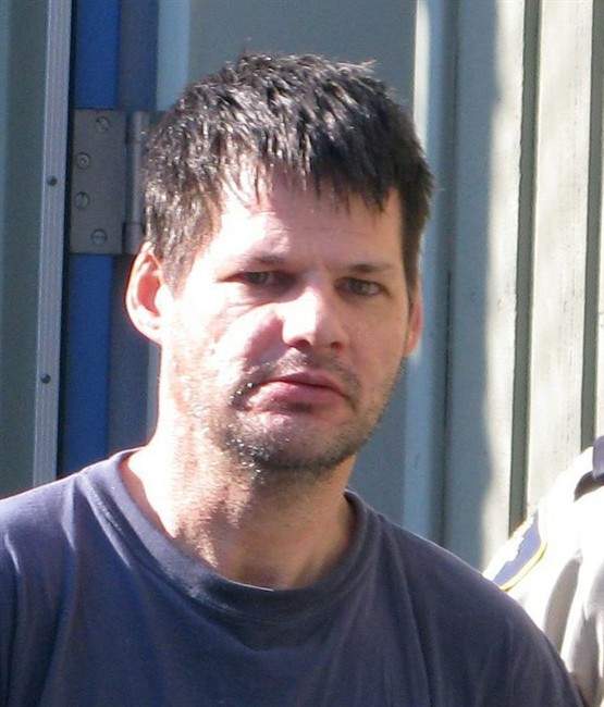 Accused child abductor Randall Hopley is led out of the Cranbrook, B.C. courthouse on Sept. 14, 2011. THE CANADIAN PRESS/Bill Graveland.