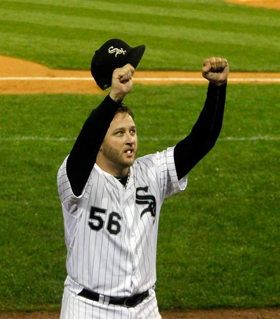 Chicago White Sox starting pitcher Mark Buehrle takes a curtain call after leaving a baseball game against the Toronto Blue Jays during the eighth inning Tuesday, Sept. 27, 2011 in Chicago. (AP Photo/Charles Rex Arbogast).