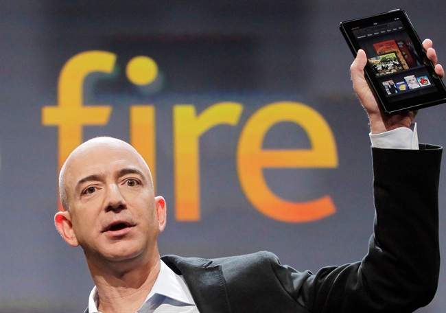 Jeff Bezos, Chairman and CEO of Amazon.com, introduces the Kindle Fire at a news conference, Wednesday, Sept. 28, 2011 in New York. The e-reader and tablet has a 7-inch (17.78 cm) multicolor touchscreen. (AP Photo/Mark Lennihan).