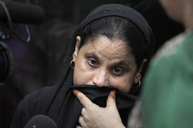 Mumtaz, whose father was killed in a bomb explosion at the High court, waits for the release of his body at a hospital, in New Delhi, India, Wednesday, Sept. 7, 2011. A bomb hidden in a briefcase exploded Wednesday outside a crowded entrance to a New Delhi courthouse, the deadliest attack in India's capital in nearly three years. (AP Photo/Manish Swarup).