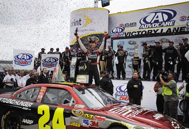 Gordon holds off Johnson to win rain-delayed race for 85th career