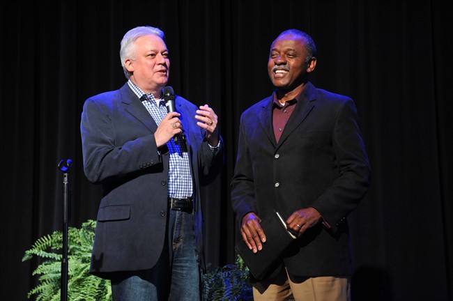 in a Wednesday, Sept. 21, 2011 photo, Michael Catt, left, pastor of Sherwood Baptist Church in Albany, Ga., introduces Mt. Zion Baptist Church pastor Daniel Simmons during Sherwood's annual ReFRESH conference. The ministers and their congregations have forged a friendship, and often hold joint worship services. (AP Photo/Todd Stone).