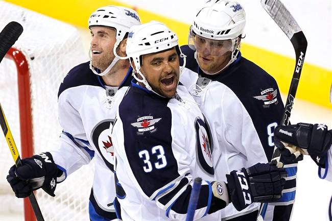 Dustin Byfuglien (33) says he's ready to help make the Jets a playoff team.