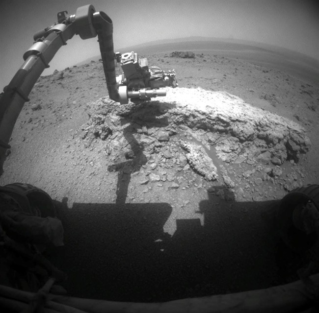 This image provided Thursday Sept. 1, 2011 by NASA shows NASA's Mars Exploration Rover Opportunity using its camera.