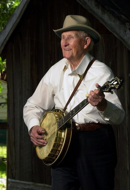 In this June 9, 2003 photo, country music pioneer Wade Mainer plays his banjo in Mocksville, N.C. Wade Mainer, a country music pioneer who is credited with inventing the two-finger banjo picking style that paved the way for the Bluegrass era, has died. He was 104. (AP Photo/The Charlotte Observer, Robert Lahser).