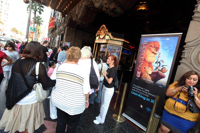 In this Sept. 17, 2011 photo provided by Time Warner Cable, guests gather outside before a Time Warner Cable and Disney screening of "The Lion King" 3D at The El Capitan Theatre, in Los Angeles. Walt Disney's "The Lion King" reissue was No. 1 for the second-straight weekend with $22.1 million, according to studio estimates Sunday, Sept. 25, 20311. That puts it just ahead of Pitt's baseball drama "Moneyball," a Sony Pictures release that opened at No. 2 with $20.6 million. (AP Photo/Time Warner Cable, Casey Rodgers).