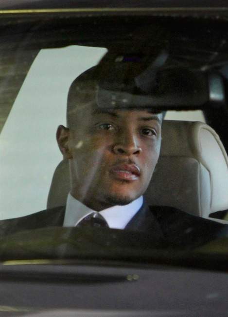 FILE - In a Friday, Oct. 15, 2010 file photo, rapper T.I., whose real name is Clifford Harris Jr., leaves Federal Court after being sentenced to 11 months in prison for a probation violation, in Atlanta. Rapper T.I. is set to be released from an Atlanta halfway house Thursday, Sept. 29, 2011, after spending about 10 months in federal prison on a probation violation. (AP Photo/David Goldman, File).